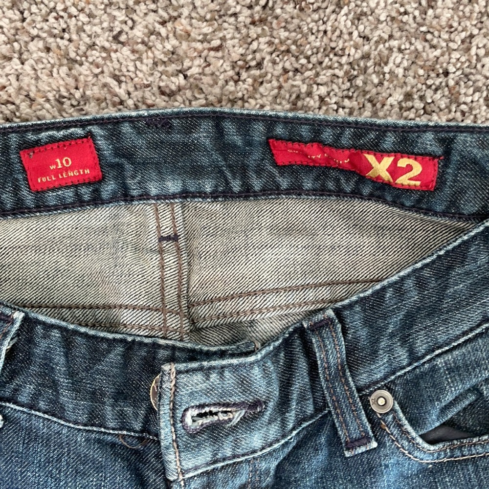 X2 mid rise flared distressed denim jean